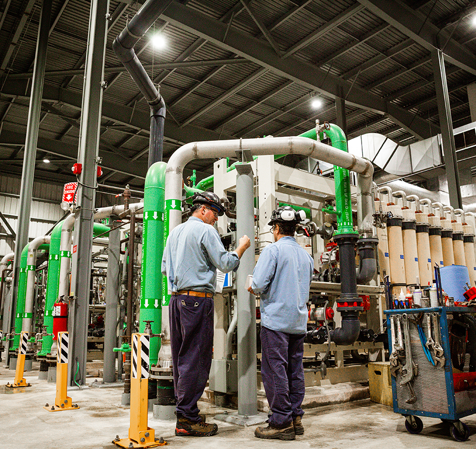 Workers inside a natural gas facility